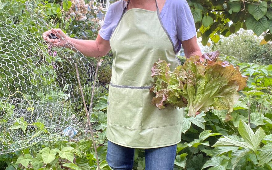 Tracy wearing GRASS colored green apron